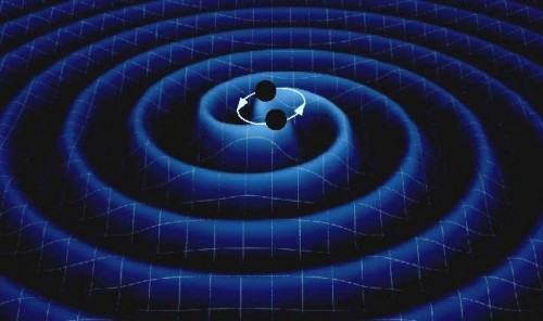 Rappresentazione artistica di un sistema di due corpi massicci (stelle di neutroni o buchi neri) in rotazione che perdono energia a causa dell’emissione di onde gravitazionali.